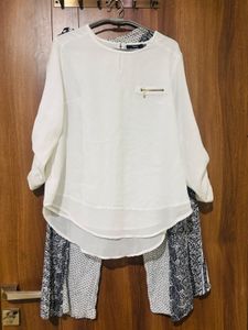white top with black trousers