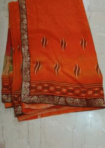 Vibrant Orange Saree with Golden Border