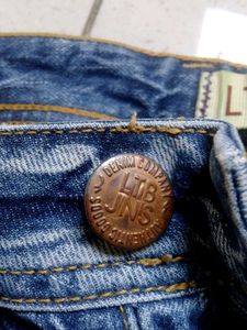 Distressed Blue Denim Jeans