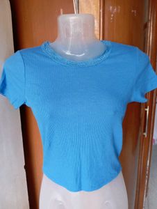 Blue Ribbed Lettuce Hem Top