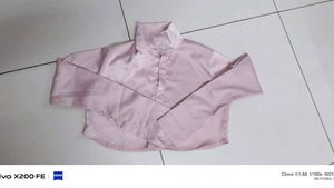 it's a peach pink colour full sleeve, crop shirt