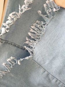 Light Wash Bell Bottom Jeans with Fringed Hem
