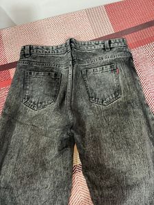 Acid washed distressed black oversized jeans