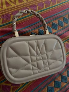 Quilted Oval Handbag