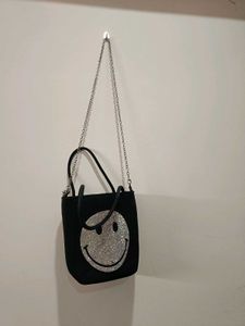 Rhinestone studded smiley face crossbody bag