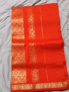 Vibrant Orange Saree with Gold Border