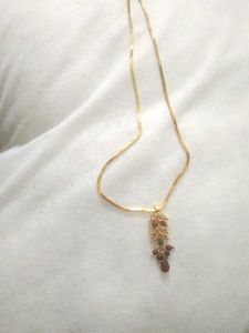 golden chain with ruby pendent