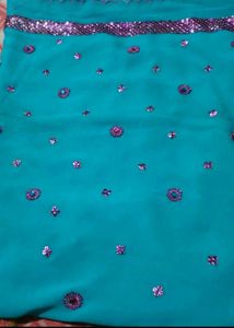 Teal Saree with Floral Embellishments