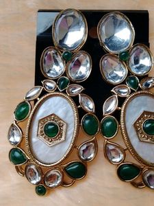 Elegant Oval Earrings with Green Stones