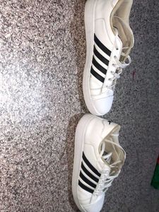 crisp white Sparx sneakers