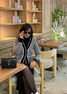 Chic grey cardigan with contrast trim 🤍