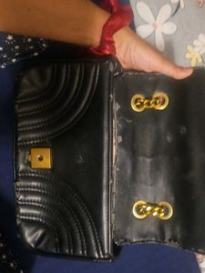 Chic Black Quilted Handbag with Gold Hardware