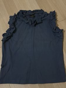 Chic Sleeveless Top with Ruffle Neckline