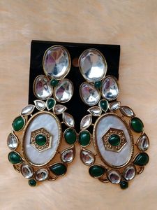 Elegant Oval Earrings with Green Stones