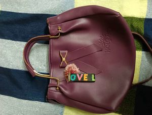 Chic Purple Handbag with Bow Accent