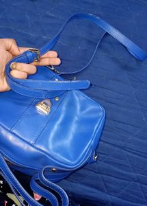 Vibrant Blue Handbag with Embellished Clasp