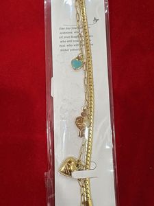Gold Tone Charm Bracelet