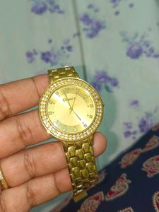 Elegant Gold Tone Watch with Crystal Accents