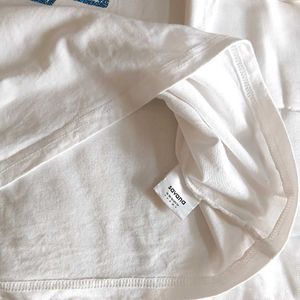 White T-Shirt with Blue Star Appliques