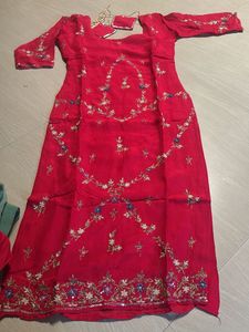 Vibrant pink suit with Silver Border