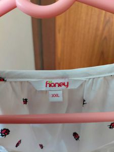 White Top with Red Ladybug Print