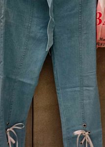 Light Wash Flare Jeans with Tie Detail