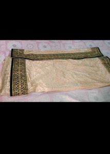 Elegant Cream Saree with Gold Embellishments