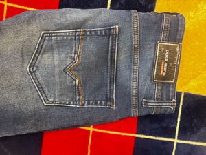 Distressed Blue Denim Jeans