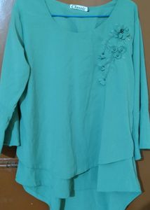 Aqua Green Top With Embroidery Design In The Front And Bell Sleeve