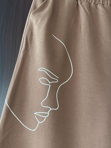 Brown Wide-Leg Pants with Abstract Face Art