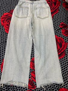 Light Wash Wide Leg Jeans with Distressed Detail