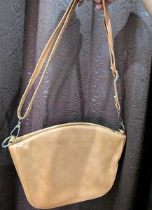 Chic Tan Shoulder Bag with Tiger Emblem