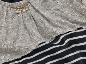Chic Grey Sleeveless Top with Embellished Neckline