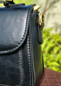 Chic Black Handbag with Embellished Detail