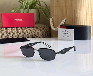Prada Sunglasses - Gold Frame