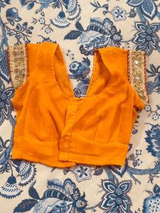 Exquisite Orange Saree with Embellishments