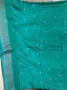 Elegant Teal Saree with Subtle Motifs