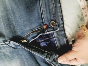 Distressed Blue Denim Jeans