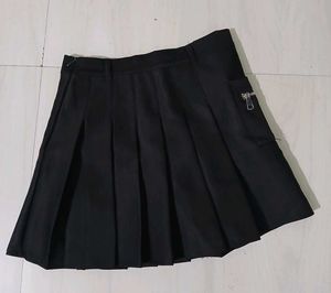 Classic black pleated mini skirt.