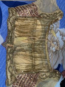 golden bridal type lehanga with blouse and duppata