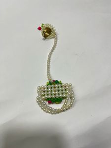 Pearl bracelet with attached ring