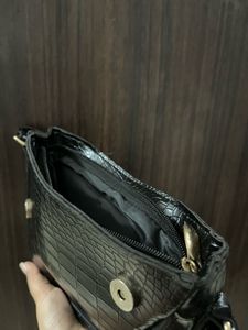 black textured shoulder bag