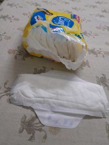 pack of Sanitary Napkins and baby diapers
