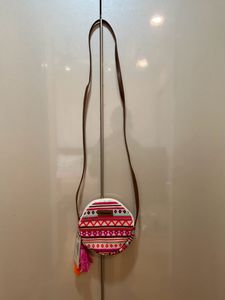 Astrid round Geometric print sling bag for women
