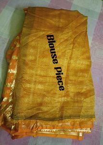 Elegant yellow Saree with Gold Details
