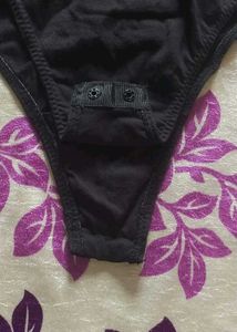 blacksatinbodysuit with a collared, wrap-style Top