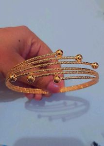 Elegant Gold Tone Coil Bracelet