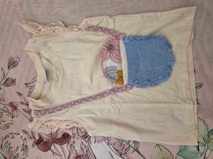Top with attached denim slig bag