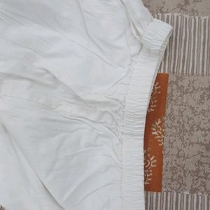 white stretchable pant for suits. size is small and the fabric is stretchable.