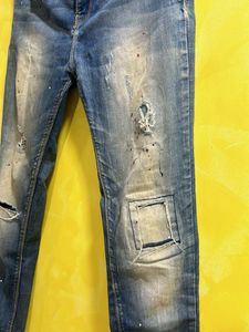 Distressed Blue Jeans with Paint Splatter